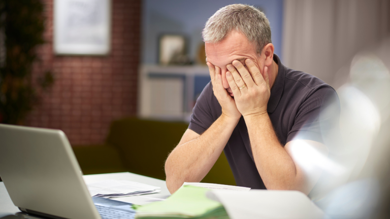 man trying to fill out ADL forms on his computer by himself